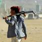 An Yemeni man holds an AK-47 as people gather in the capital Sanaa to show their support to the Shiite Huthi movement against the Saudi-led intervention, on December 19, 2018