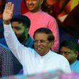 Sri Lanka's President Maithripala Sirisena waves to supporters at a rally in Colombo on November 5, 2018