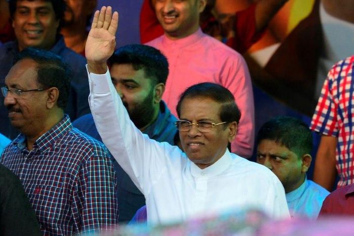 Sri Lanka's President Maithripala Sirisena waves to supporters at a rally in Colombo on November 5, 2018