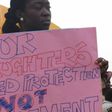 A lady protesting against the rise of paedophilia in Nigeria