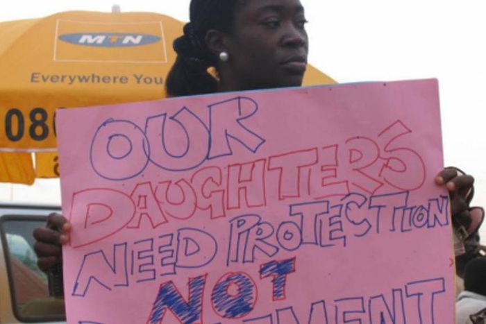 A lady protesting against the rise of paedophilia in Nigeria