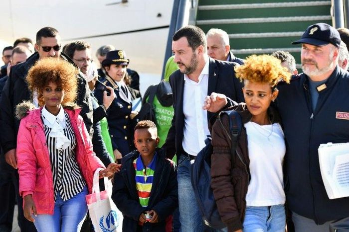 Italy’s Interior Minister and deputy PM Matteo Salvini (C) welcomes on November 14, 2018 a group of 51 migrants from Niger, entitled to international protection, upon their arrival at the Mario De Bernardi military airport in Pratica di Mare, south of ...