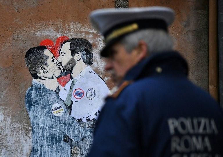 Happier times: a street mural in Rome shows Five Star leader Luigi Di Maio kissing League chief Matteo Salvini in this March 23 file photo