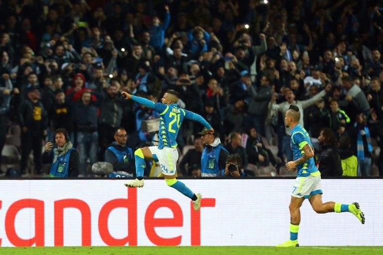 Lorenzo Insigne (C) celebrates after levelling for Napoli from the spot in a 1-1 Champions League Group C draw with Paris Saint-Germain.
