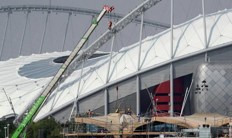 Labourers undertake restoration work at Doha's Khalifa International Stadium