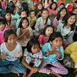 Children displaced by the tsunami play games to take their minds off the disaster
