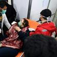 A Syrian woman receives treatment at a hospital after an assault on Aleppo, which Russia claimed was a chemical attack by rebels