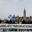 Right-wing protesters rally against the UN international pact on migration at Parliament Hill in Ottawa