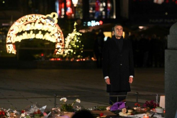 French President Emmanuel Macron pays tribute to the attack victims in Strasbourg