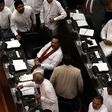 A majority of Sri Lanka's parliament supported a no-confidence motion against former president and currently appointed prime minister, Mahinda Rajapakse (C)