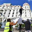 "Yellow vest" protesters use a sheet to bounce an effigy of President Emmanuel Macron in Nice, southern France, during nationwide demonstrations on Saturday, December 15