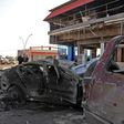 Wrecked vehicles line the street outside the Abu Layla restaurant in Iraq's Mosul on November 9, 2018, after three people were killed in the first car bombing to hit the second city since its recapture from the Islamic State group in July last year