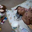 Brazilian Thamires Ferreira da Silva, 29, changes her two-year-old son Matheus, who was born with microcephaly