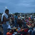 Hondurans taking part in US-bound migrant caravan, on the border bridge between Guatemala and Mexico at Tecun Uman, on October 19, 2018.