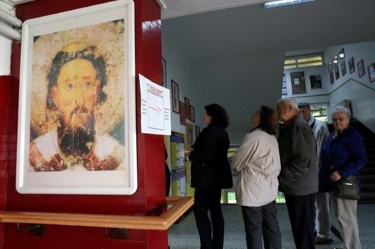 People queue at a polling station in Bosnia where people are concerned about economic woes with one fifth of the population unemployed