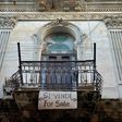 The balcony of an apartment carries a "For Sale" sign, in Havana, Cuba on November 6, 2018