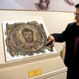 Director of the Cyprus Byzantine Museum Ioannis Eliades shows a centuries-old mosaic of Saint Mark in Nicosia on November 21, 2018