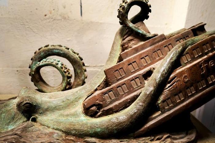 Artist Joseph Reginella's sculptures depict fake news events -- like this one of the supposed deadly Staten Island Ferry Octopus Disaster in November 1963... which never happened