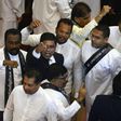On Wednesday parliament reconvened and lawmakers approved a motion of no-confidence in Rajapakse's cabinet, also passing motions declaring Sirisena's moves as illegal