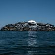 A newly-built tin roof shines on top of Migingo island where its residents fish mainly for Nile perch in Lake Victoria on the border of Uganda and Kenya