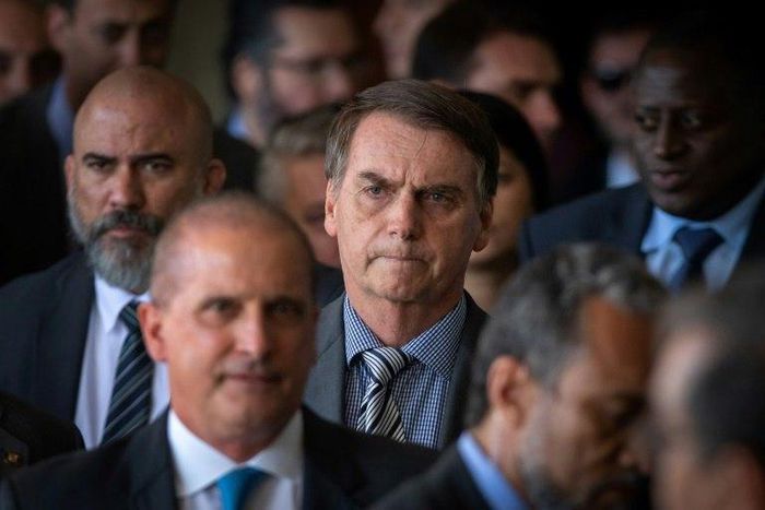 Brazil's president-elect Jair Bolsonaro (center) is an ex-army captain and has appointed seven military personnel to his cabinet