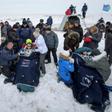 Rescuers pulled the crew members out of the capsule