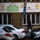 A woman walks in front of a maternity hospital in Belgrade. The government wants to boost the country's birth rate of 1.5 children per family, one of the lowest in Europe