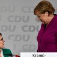 Merkel (R) got a political boost after her handpicked successor, Annegret Kramp-Karrenbauer (L), become newly-elected leader of her party