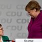 Merkel (R) got a political boost after her handpicked successor, Annegret Kramp-Karrenbauer (L), become newly-elected leader of her party