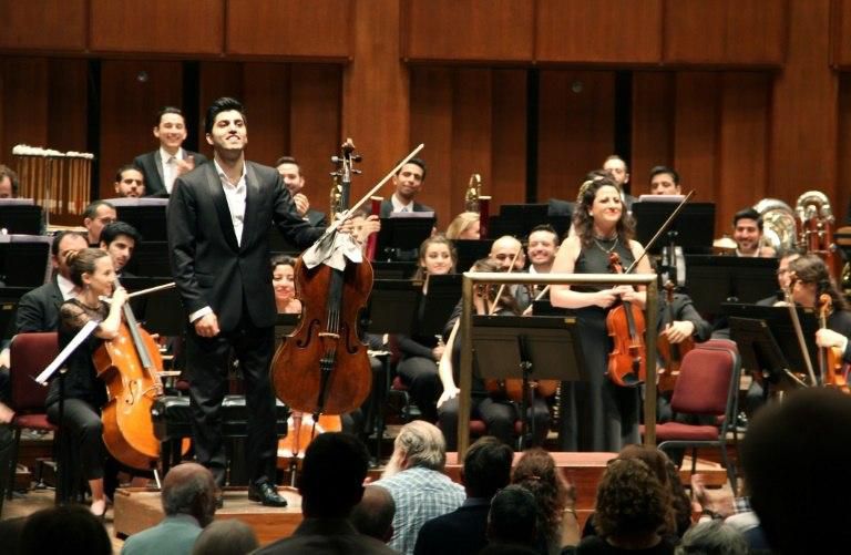 Kian Soltani, left, who plays on a 1680 cello by the Grancino brothers, and violist Miriam Manasherov stand after playing solos in Richard Strauss's "Don Quixote" at the John F Kennedy Center for the Performing Arts in Washington on November 7, 2018