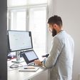 ___9155541___2018___11___30___21___young-bearded-man-working-at-his-office-royalty-free-image-996080338-1543599599