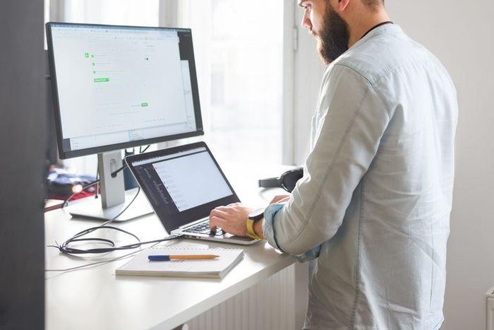 ___9155541___2018___11___30___21___young-bearded-man-working-at-his-office-royalty-free-image-996080338-1543599599