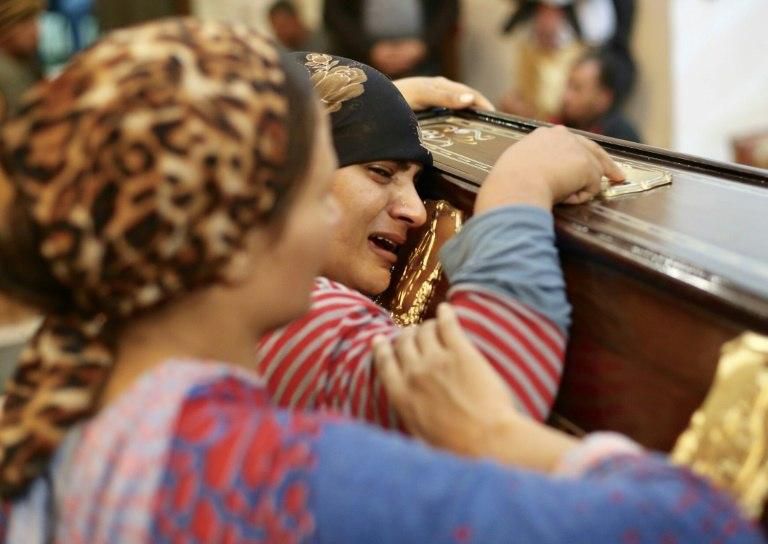 Egyptian mourners attend the funeral of Anglican Assad Labib, 35, at a church in Sawaada village near Minya city early on November 3, 2018