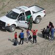 Asylum seekers turn themselves in to a US Border Patrol agent after crossing from Mexico into the United States on November 7, 2018 in Mission, Texas