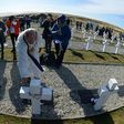 A priest blesses the grave of an Argentine soldier killed during the 1982 war between Argentina and Britain, at a military cemetery in the Falkland Islands, known in Spanish as the Malvinas