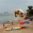 People enjoy the beach in Mazatlan, Mexico on October 21, 2018, ahead of an expected hit from Hurricane Willa