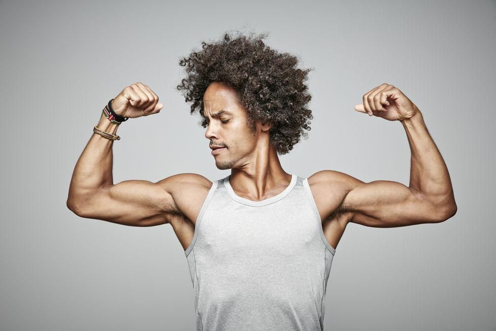 ___9005510___2018___10___21___22___portrait-of-man-with-afro-flexing-his-muscles-royalty-free-image-668769547-1539806233