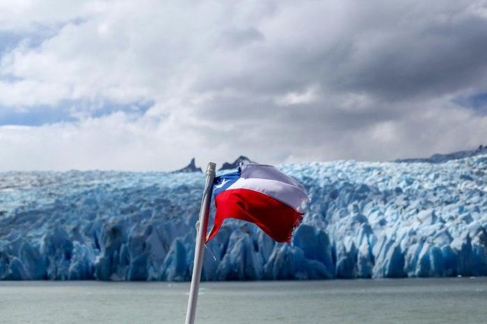 Chile's flag flies near a glacier at a national park in Patagonia, where Argentina recently claimed a glacier field along the countries' joint border