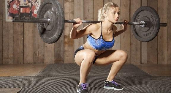 A Barbell squat can help you get closer to your body goals.