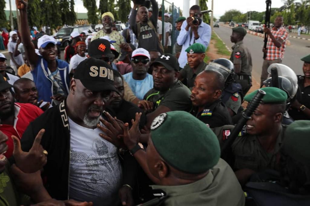 Senator Dino Melaye clashes with police officers at Abuja protest