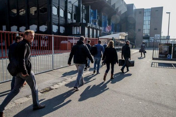 Investigators enter the premises of Belgium's football club Club Brugge, where they undertook searches as part of a larger investigation on tax evasion, money laundering and possible match-fixing