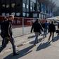 Investigators enter the premises of Belgium's football club Club Brugge, where they undertook searches as part of a larger investigation on tax evasion, money laundering and possible match-fixing