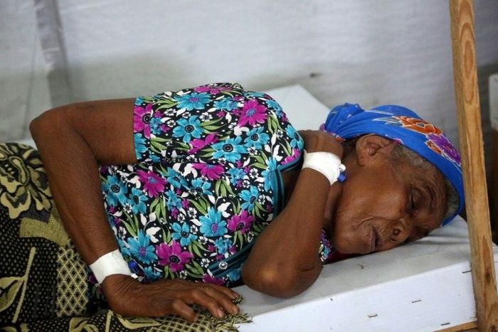 A woman is treated in the Yemeni coastal city of Hodeida, which has seen cases nearly triple in the past three months alone as conflict helps to spread the disease