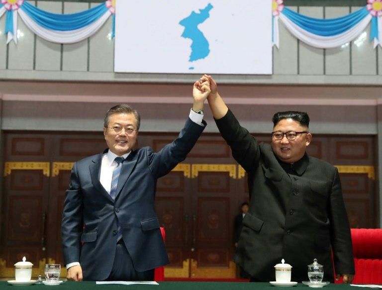 South Korean President Moon Jae-in and North Korean leader Kim Jong Un, pictured in September, have joined hands in a number of symbolic gestures
