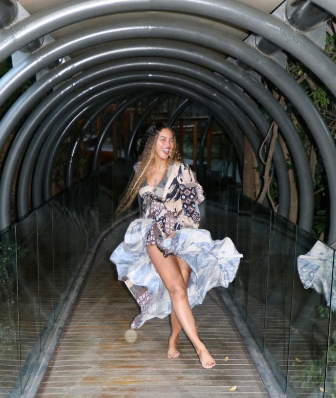 Beyonce daning in a printed dress