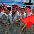 Iranian members of the Basij militia march during a parade marking the country's Army Day