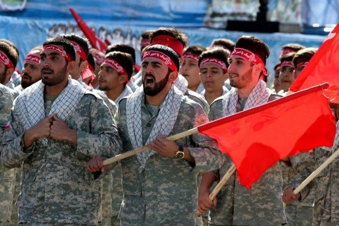 Iranian members of the Basij militia march during a parade marking the country's Army Day