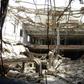 A man inspects the ruins of a factory hit by fierce fighting for the Yemeni port city of Hodeida that a UN-brokered truce which went into effect on Tuesday is intended to halt