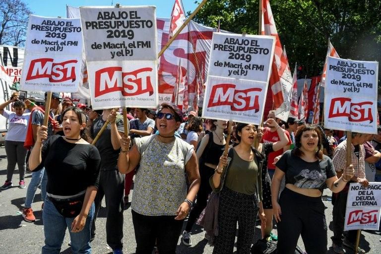 Protesters demonstrate as Argentina's senate votes to approve an austerity budget in line with an IMF loan