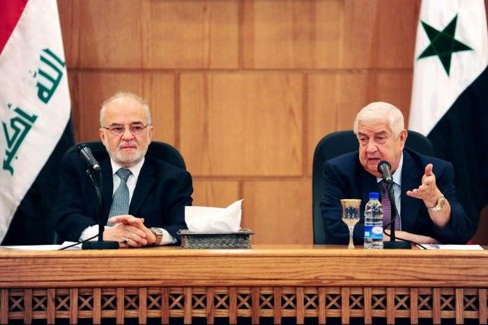 This picture from the official Syrian Arab News Agency (SANA) shows Syrian Foreign Minister Walid Muallem (R) speaking in Damascus alongside his Iraqi counterpart Ibrahim Jaafari on October 15, 2018